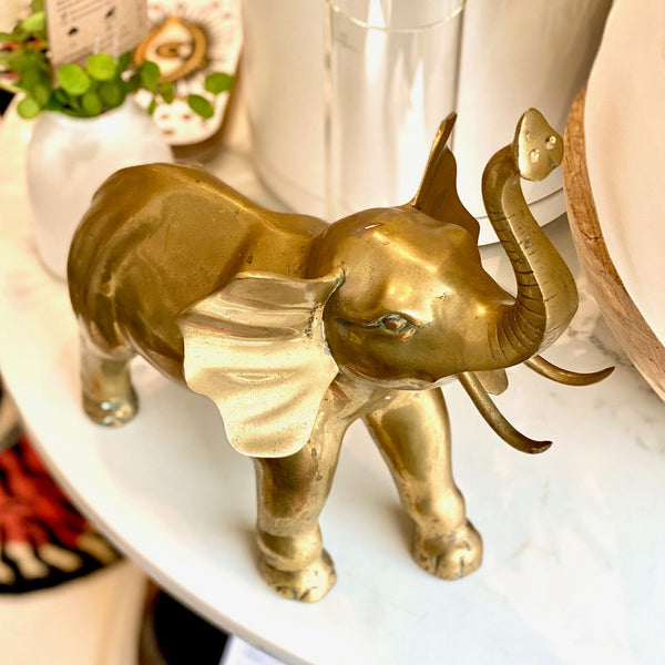 brass elephant at details by mr k